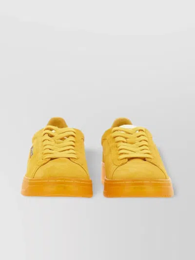 Autry Transparent Sole Trainers With Contrasting Accents In Yellow