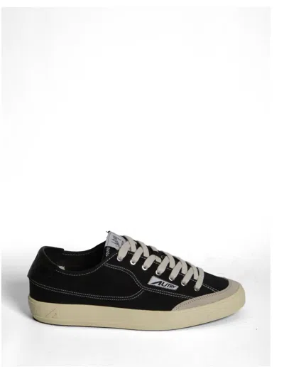 Autry Low Top Sneakers In Fabric With Leather Inserts In Black