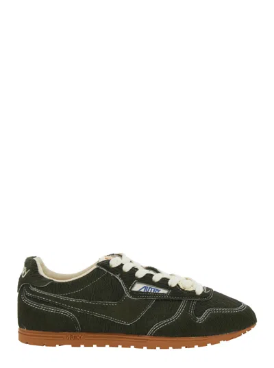 Autry Windspin Suede Low-top Sneaker With Logo Patch On Tongue And Heel Lettering In Black