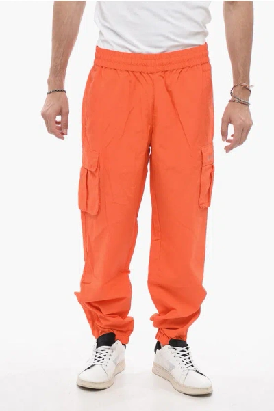 Awake New York Solid Colour Nylon Trousers In Orange