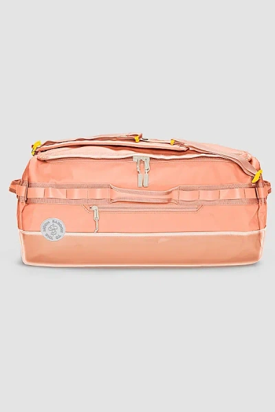 BABOON TO THE MOON GO-BAG DUFFLE BIG IN CORAL AT URBAN OUTFITTERS