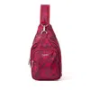 Baggallini Central Park Sling Bag In Red Divine Rose
