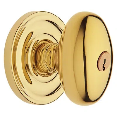 Baldwin Egg  Keyed Entry Door Knob Set With Classic Rosette In Unlacquered Brass