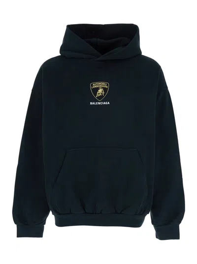 BALENCIAGA BALENCIAGA MEN BLACK HOODIE WITH FIXED HOOD AND LOGO PRINT ON THE FRONT IN COTTON MAN