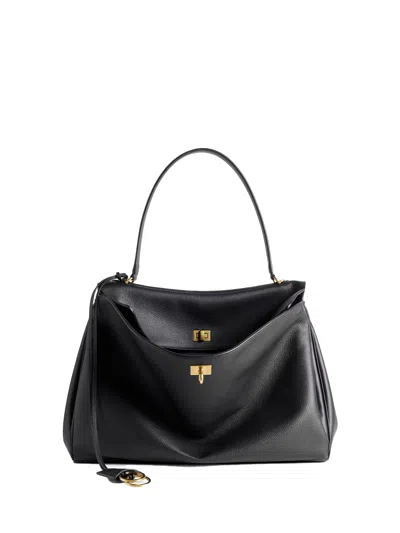 BALENCIAGA BALENCIAGA BLACK LEATHER BAG WITH GOLD DETAILS.