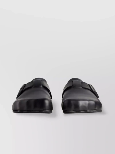 Balenciaga Buckle Strap Logo Mules With Asymmetric Toe In Black