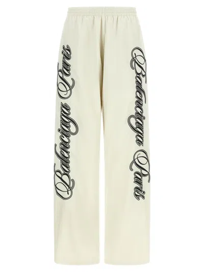 BALENCIAGA BALENCIAGA CURSIVE-EMBROIDERED POLYAMIDE JOGGERS