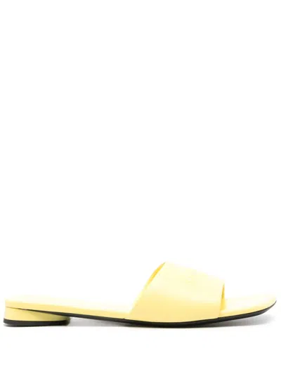 Balenciaga Duty Free Leather Slides In Yellow