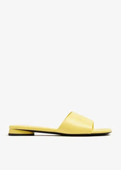 Balenciaga Duty Free Leather Slides In Yellow