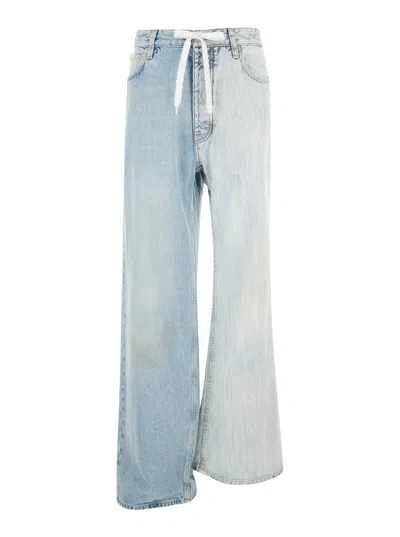 BALENCIAGA BALENCIAGA WOMEN 'FIFTY-FIFTY' LIGHT BLUE JEANS WITH ASYMMETRIC LEGS IN DENIM WOMEN