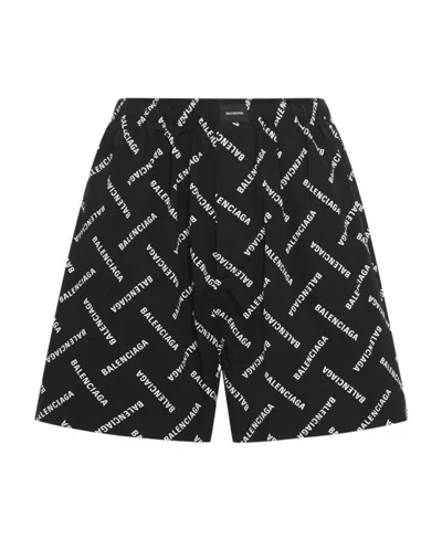 BALENCIAGA BALENCIAGA ALL-OVER LOGO BERMUDA SHORTS