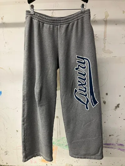 Balenciaga Luxury Script Loose Track Pants In Gray