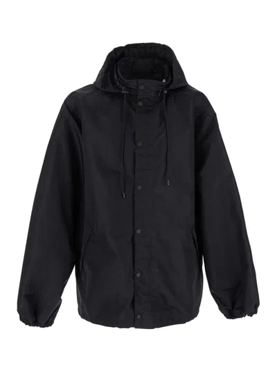 BALENCIAGA BALENCIAGA MEN BLACK JACKET WITH DRAWSTRING HOOD AND MAXI LOGO LETTERING PRINT ON THE REAR IN TECH F