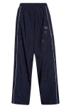 Balenciaga Paint Splatter Track Pants In 4140 Marine Blue