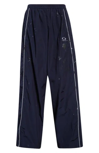Balenciaga Paint Splatter Track Pants In 4140 Marine Blue