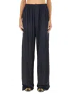 Balenciaga Stencil Logo-print Satin Trousers In Blue