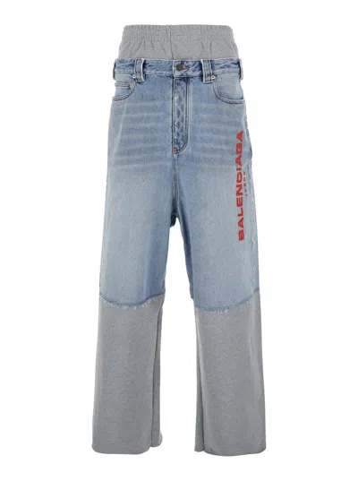 BALENCIAGA LIGHT BLUE JEANS WITH FLEECE INSERTS AND LOGO LETTERING ON THE FRONT IN COTTON AND DENIM MAN