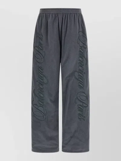 Balenciaga Reversible Trousers Featuring Cursive Motif Design In Blue