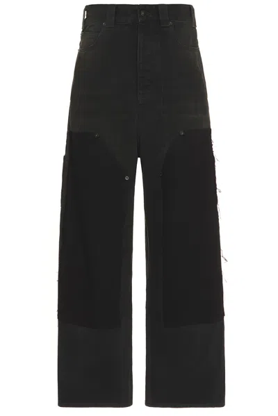BALENCIAGA RIPPED OFF BAGGY PANTS