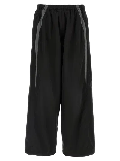 Balenciaga Men Black Oversized Tracksuit Pants With Contrasting Yokes In Tech Fabric Man
