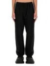 Balenciaga Black Pants With Elastic Drawstring And Side Band With Logo Lettering In Tech Fabric Man In Black