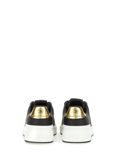 Balmain B-court Sneakers In Black And Gold Leather In Black/gold