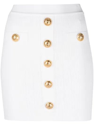 BALMAIN BALMAIN CHIC BUTTON-DETAIL KNITTED MINISKIRT.