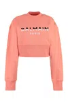 BALMAIN CROPPED CORAL VELVET SWEATSHIRT WITH EMBELLISHED BUTTONS