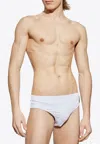 Balmain Embossed Logo Patch Swim Trunks In White