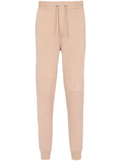 Balmain Embossed Logo Track Pants In Neutrals