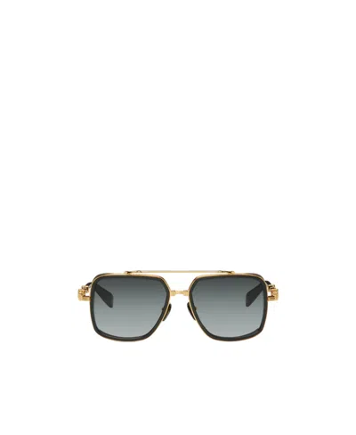 Balmain Logo Sunglasses In Gold