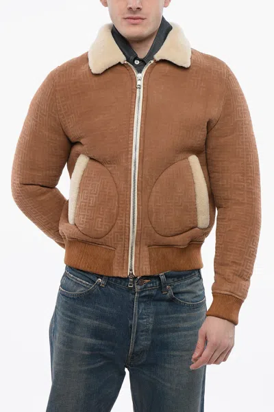 Balmain Monogrammed Shearling Bomber Jacket In Brown
