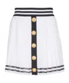 Balmain Pleated Monogrammed Knit Skirt In White