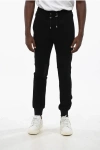 Balmain Solid Color Joggers With All-over Monogram In Black