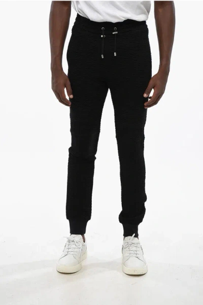 Balmain Solid Color Joggers With All-over Monogram In Black