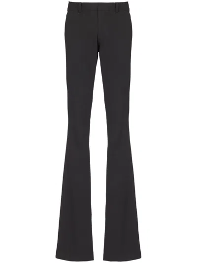 Balmain Flared Wool Tailored Trousers In ブラック