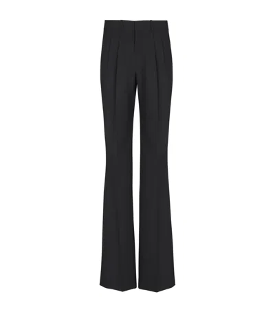 Balmain Virgin Wool Pleated Flared Trousers In Black