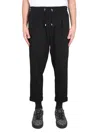 Balmain Timeless Embossed-button Drawstring-waist Trousers. In Black
