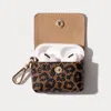 Bandolier Avery Airpods Clip-on Pouch - Dark Leopard/gold