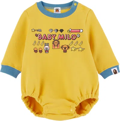 Bape Baby Yellow Baby Milo Game Graphic Bodysuit In Yel-yellow