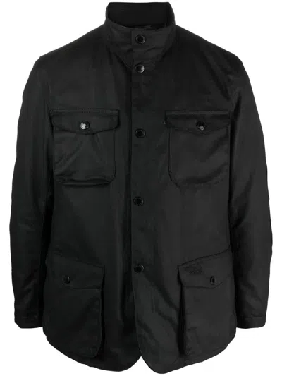 Barbour Ogston Water Resistant Waxed Cotton Jacket With Removable Quilted Bib In Black