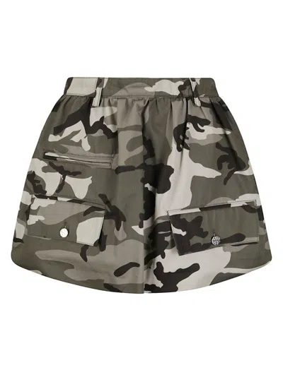 BAUM UND PFERDGARTEN MINI SKIRT WITH LOGOED SILVER BUTTONS AND FRONT POCKETS