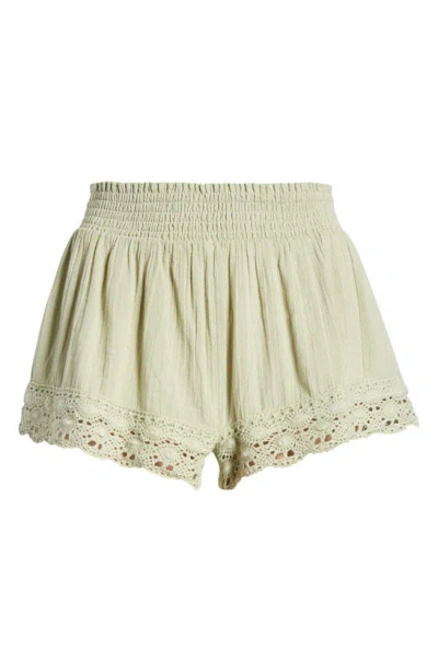 Bdg Urban Outfitters Smocked Waist Lace Hem Cotton Shorts In Light Green