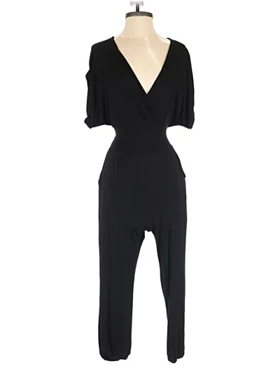 Pre-owned Bebe Jumpsuit In Black