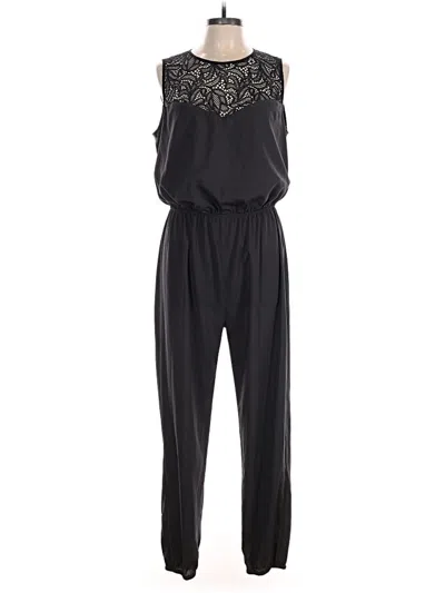 Pre-owned Bebe Jumpsuit In Black