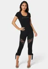 Shop Bebe Lace Insert Bow Capri Legging In Black