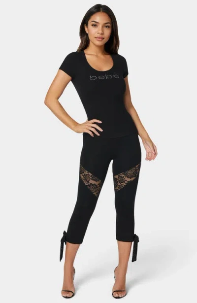 Bebe Lace Insert Bow Capri Legging In Black