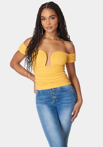 Bebe Ruched Cut Out Cold Shoulder Knit Top In Banana