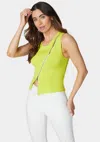 Bebe Sleeveless Assymetric Zipper Sweater Top In Cyber Lime