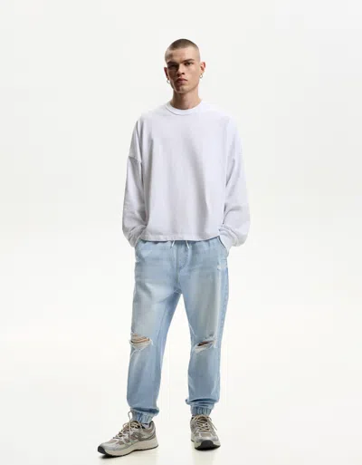 Bershka Ripped Jogger Jeans In Blue